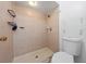 Bathroom showing tiled shower with shower head and built-in soap dish at 86 Pine Island Cir, Kissimmee, FL 34743