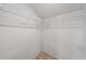 Walk-in closet with wire shelving to maximize storage space and tile flooring at 86 Pine Island Cir, Kissimmee, FL 34743