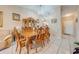 Formal dining room featuring decorative wood table and chairs plus a vintage hutch and chandelier at 86 Pine Island Cir, Kissimmee, FL 34743