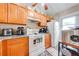 Well-lit kitchen offers granite countertops, modern appliances, and functional layout at 86 Pine Island Cir, Kissimmee, FL 34743
