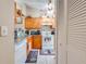 Bright kitchen features ample cabinetry, granite counters, and modern appliances at 86 Pine Island Cir, Kissimmee, FL 34743