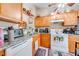 Bright view of kitchen features modern appliances and ample space for storage and food prep at 86 Pine Island Cir, Kissimmee, FL 34743