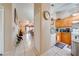 Open-concept kitchen view with modern appliances connecting to living and dining areas at 86 Pine Island Cir, Kissimmee, FL 34743