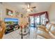View of cozy living room showing seating, glass table and view to the exterior at 86 Pine Island Cir, Kissimmee, FL 34743