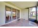 Covered patio with brick flooring, offering a peaceful outdoor space at 86 Pine Island Cir, Kissimmee, FL 34743