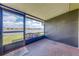 Screened porch with brick flooring and tranquil lake views at 86 Pine Island Cir, Kissimmee, FL 34743