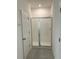 Bathroom with a glass shower and a white tiled walls at 9690 Emerald Berry Dr, Winter Garden, FL 34787