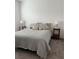 Bedroom featuring neutral decor, carpet, and side tables with lamps at 9690 Emerald Berry Dr, Winter Garden, FL 34787
