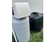 An outdoor view shows a well-maintained water filtration system with a protective black case at 9690 Emerald Berry Dr, Winter Garden, FL 34787