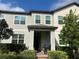 Charming two-story townhome with well-maintained landscaping and inviting front entrance at 9690 Emerald Berry Dr, Winter Garden, FL 34787