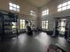Well-equipped gym with a variety of exercise machines, free weights and ample natural light for a healthy lifestyle at 9690 Emerald Berry Dr, Winter Garden, FL 34787