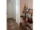 Hallway with decorative wine rack and plants at 9690 Emerald Berry Dr, Winter Garden, FL 34787