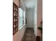 Hallway with natural light and neutral decor at 9690 Emerald Berry Dr, Winter Garden, FL 34787