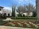 Beautifully landscaped yard with colorful flowerbeds, lush greenery and manicured lawns, enhancing curb appeal at 9690 Emerald Berry Dr, Winter Garden, FL 34787