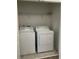 Laundry room featuring a white washer and dryer at 9690 Emerald Berry Dr, Winter Garden, FL 34787