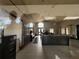Welcoming lobby area with stylish tiled floors, a high ceiling, and a comfortable seating area for residents and visitors at 9690 Emerald Berry Dr, Winter Garden, FL 34787