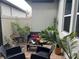 Private outdoor patio with comfortable seating, perfect for relaxation at 9690 Emerald Berry Dr, Winter Garden, FL 34787