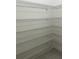 Walk-in closet equipped with multiple wire rack shelves for optimal storage at 9690 Emerald Berry Dr, Winter Garden, FL 34787