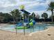 Community water park featuring a colorful water slide, a splash pad, and resort-style pool with ample lounge seating at 9690 Emerald Berry Dr, Winter Garden, FL 34787