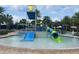 Community water park featuring a colorful water slide, a splash pad, and resort-style pool with ample lounge seating at 9690 Emerald Berry Dr, Winter Garden, FL 34787