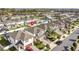 Aerial view of a residential neighborhood with well-maintained lawns and landscaping surrounding each home at 9811 Aurea Moss Ln, Orlando, FL 32832
