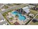 Aerial view of community pool, playground, and neighborhood with sidewalks on a sunny day at 9811 Aurea Moss Ln, Orlando, FL 32832