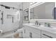 Stylish bathroom showcasing a glass-enclosed shower, marble countertop, modern vanity, and sleek black fixtures at 9811 Aurea Moss Ln, Orlando, FL 32832