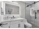 Stylish bathroom with a sleek vanity, backlit mirror, and a modern glass-enclosed shower at 9811 Aurea Moss Ln, Orlando, FL 32832