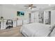 Spacious bedroom featuring a desk, tv, and walk-in closet at 9811 Aurea Moss Ln, Orlando, FL 32832