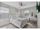 Cozy bedroom featuring a comfortable bed, stylish vanity, and ample natural light for relaxation and comfort at 9811 Aurea Moss Ln, Orlando, FL 32832