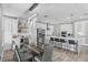 Modern dining area next to a beautiful kitchen, features a glass-top table and ample space for Gathering gatherings at 9811 Aurea Moss Ln, Orlando, FL 32832