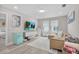 Cozy living room featuring a modern entertainment center, comfortable sectional, and stylish decor for relaxation at 9811 Aurea Moss Ln, Orlando, FL 32832