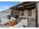 Outdoor patio area offers a dining set, lounge chairs, and barbecue grill, perfect for outdoor entertaining at 9811 Aurea Moss Ln, Orlando, FL 32832