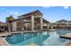 Community pool with a covered seating area and plenty of lounge chairs for residents to enjoy at 9811 Aurea Moss Ln, Orlando, FL 32832