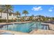 Community pool with seating and lush landscaping, offering residents a relaxing outdoor space at 9811 Aurea Moss Ln, Orlando, FL 32832