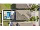 Aerial shot highlighting a private pool with a spa, modern patio, and well-manicured backyard at 9811 Aurea Moss Ln, Orlando, FL 32832