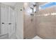 Modern shower with tiled walls, sleek fixtures, and a glass door at 9811 Aurea Moss Ln, Orlando, FL 32832