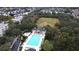 Community aerial view featuring the pool, clubhouse, and surrounding homes at 1027 Banks Rose St, Celebration, FL 34747