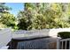 Cozy backyard patio with a white picket fence and beautiful lush greenery at 1027 Banks Rose St, Celebration, FL 34747