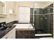 Modern bathroom with a soaking tub, glass enclosed shower, and updated fixtures at 1027 Banks Rose St, Celebration, FL 34747