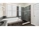 Bathroom showcasing a soaking tub next to a window and a separate glass shower at 1027 Banks Rose St, Celebration, FL 34747