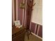 Bedroom corner featuring a vintage coat rack and a shuttered window, adding classic charm at 1027 Banks Rose St, Celebration, FL 34747