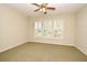 Neutral bedroom with ample natural light and ceiling fan provides inviting atmosphere at 1027 Banks Rose St, Celebration, FL 34747