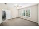 Neutral primary bedroom with carpeting and plantation shutters, offering a bright and airy feel at 1027 Banks Rose St, Celebration, FL 34747
