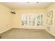 Charming bedroom offers bright windows and decorative wallpaper that adds character to the space at 1027 Banks Rose St, Celebration, FL 34747