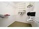 Walk-in closet with shelving and hanging rods for optimal organization of clothes and accessories at 1027 Banks Rose St, Celebration, FL 34747