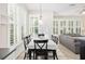 Dining area with shutters, seamlessly connected to the living space with natural light at 1027 Banks Rose St, Celebration, FL 34747