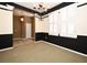 The dining room has a chandelier and views to the foyer and staircase at 1027 Banks Rose St, Celebration, FL 34747
