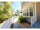 Exterior view with a well-maintained yard, white picket fence, and lush landscaping at 1027 Banks Rose St, Celebration, FL 34747