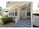 Charming home exterior with a quaint front porch and well-maintained landscaping at 1027 Banks Rose St, Celebration, FL 34747
